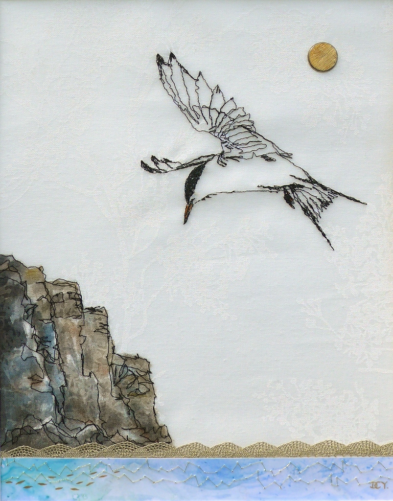 Machine sewn drawing of a tern fishing with collage by artist Diane Young